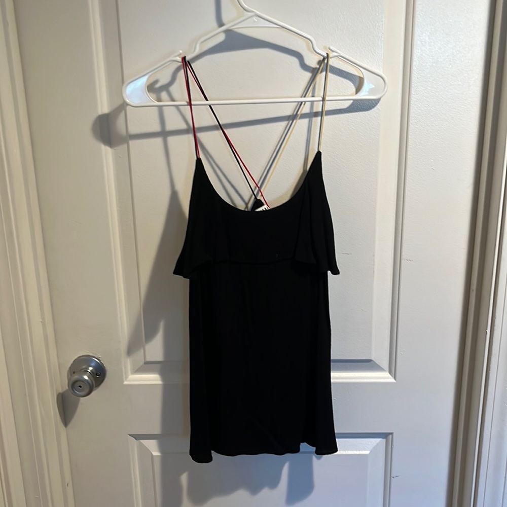 Black ruffled top with primary colored straps